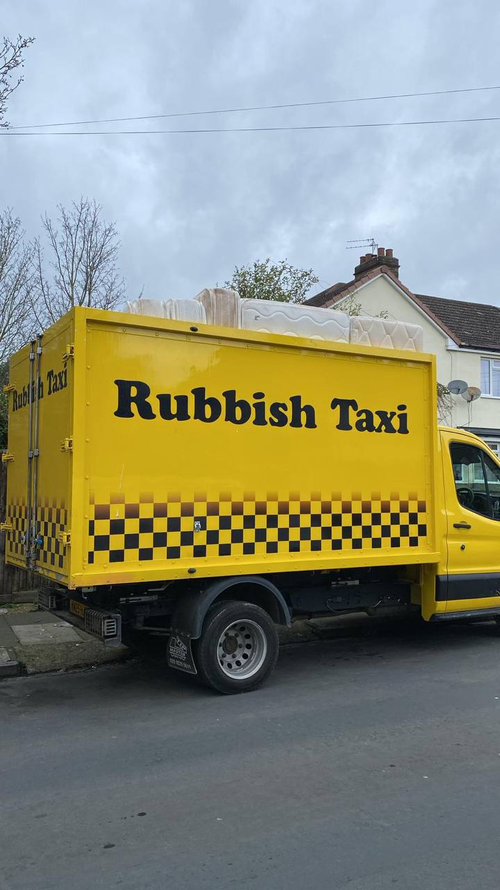 Rubbish Taxi truck loaded with waste in Hackney, East London
